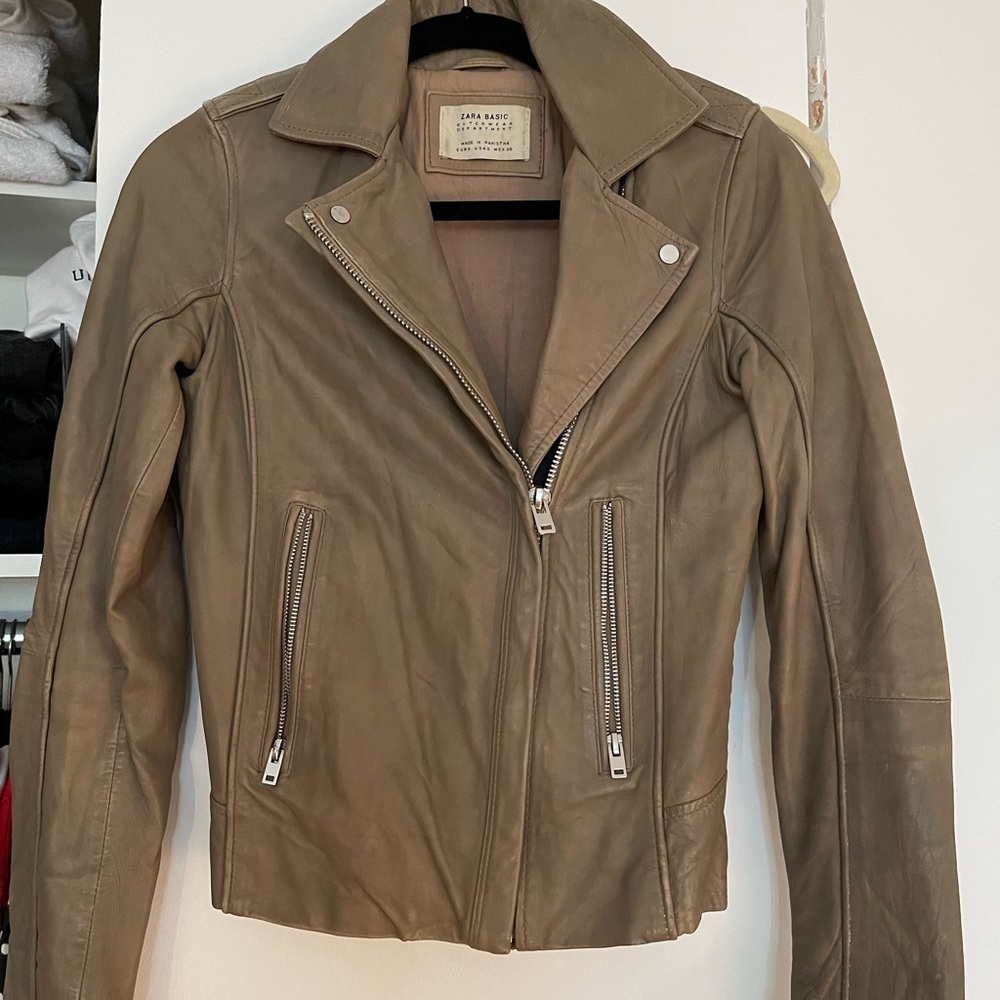 Beige leather jacket.